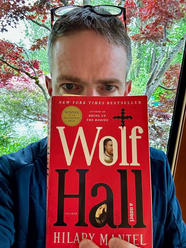 A photo of me and the cover of Wolf Hall